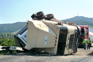 What are the most common contributory factors behind accidents between commercial trucks and automobiles?